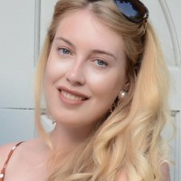 Photo of a smiling woman with long blonde hair, Kirsty Harrison.