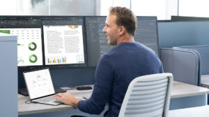 A man sitting at a desk with a laptop