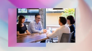 A group of business professionals sitting at a table