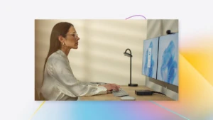 A woman sitting at a desk using a computer
