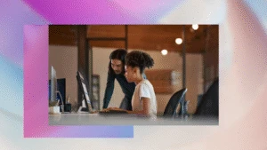 Enterprise office workers collaborating in an open work space.