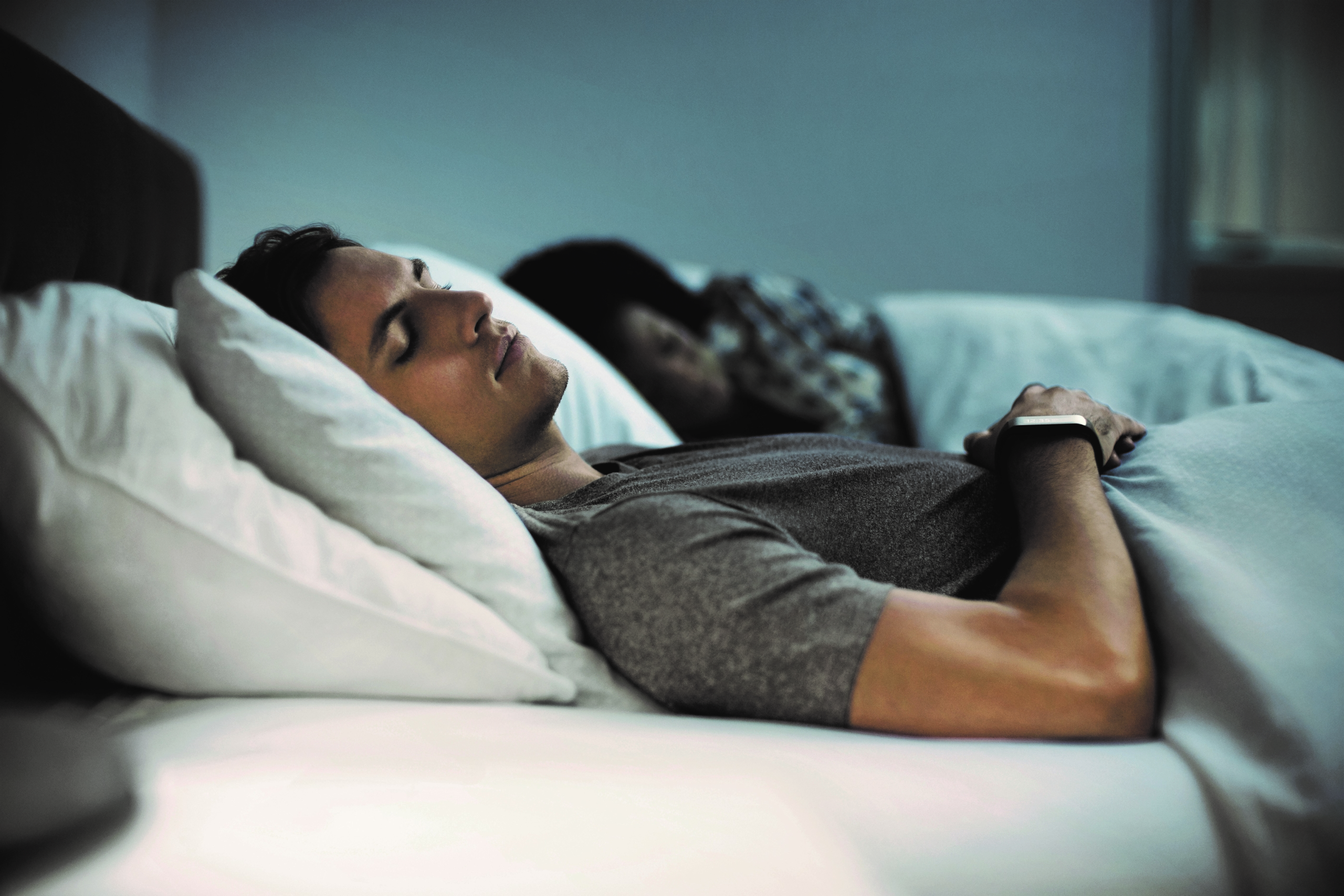 a person lying on a bed