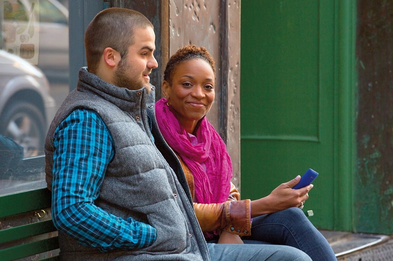 a group of people sitting in a chair