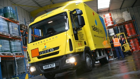 a yellow truck on the street