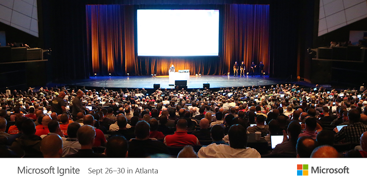 a group of people standing in front of a large crowd watching