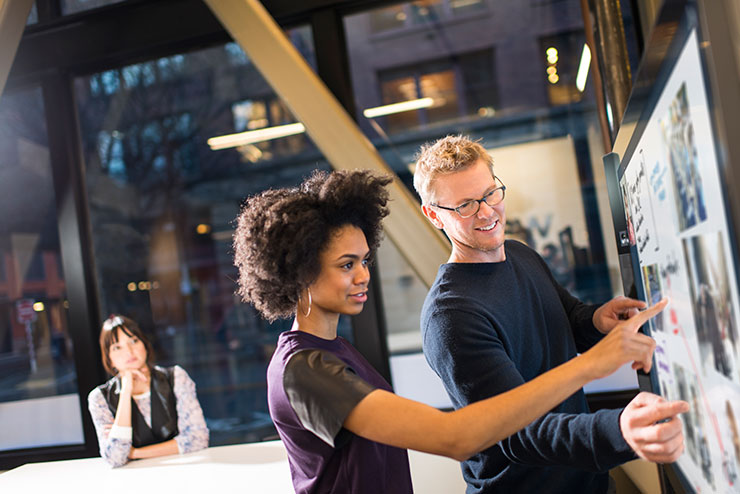 a group of people standing next to a person