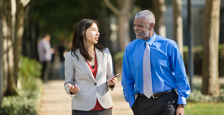 a group of people standing next to a person