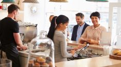Cashier taking an order in cafe