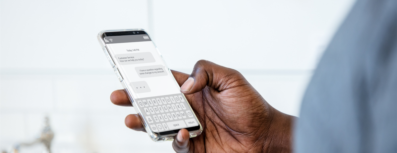 a hand holding a remote control