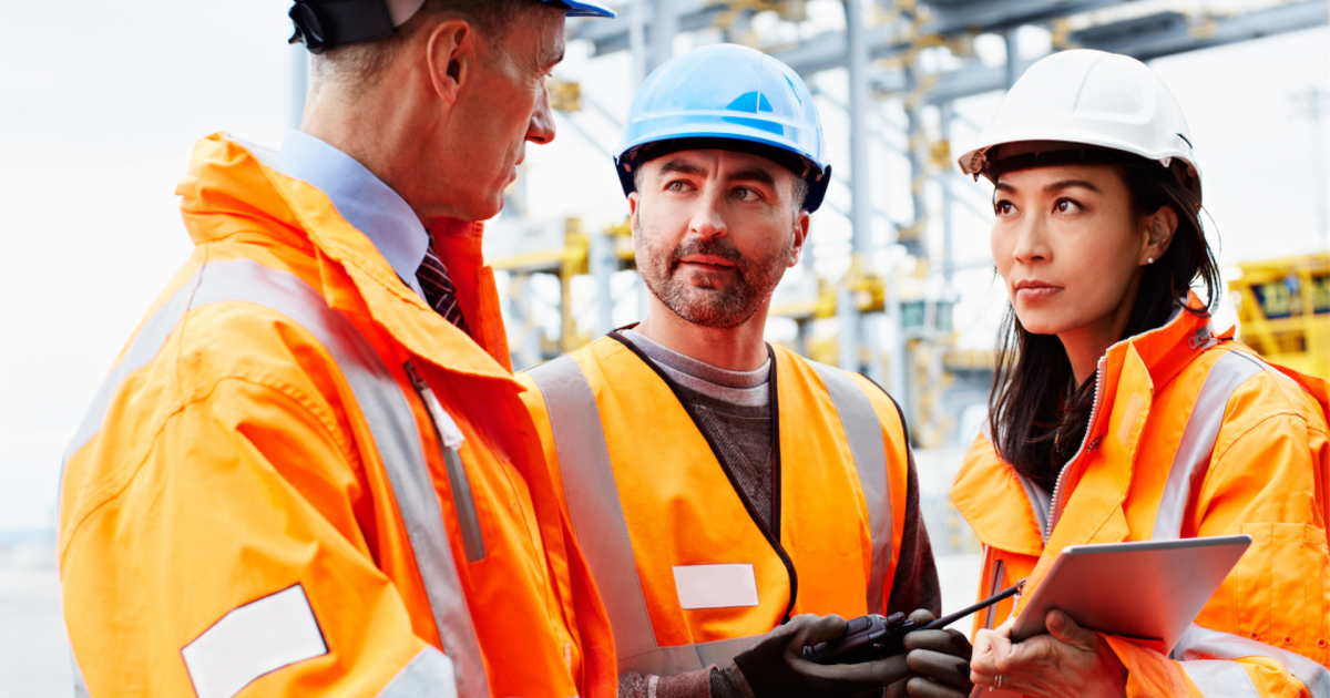 a group of people wearing orange