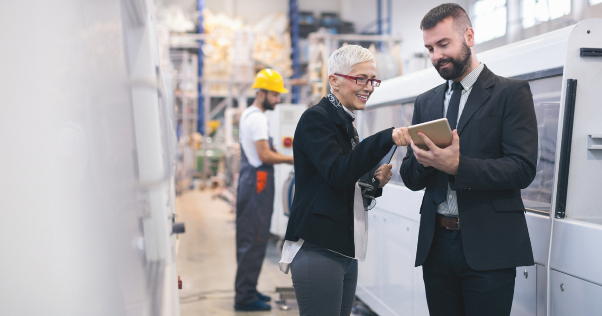 a man and a woman walking down a street