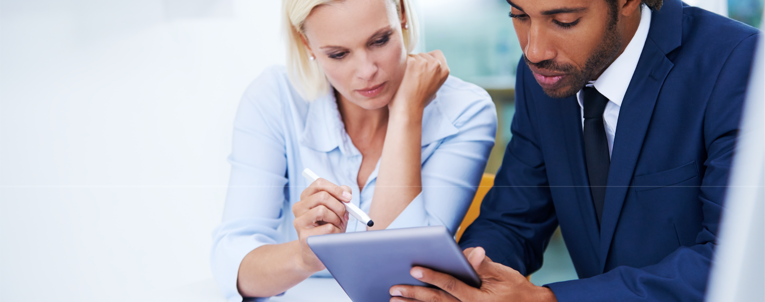a group of people looking at a laptop