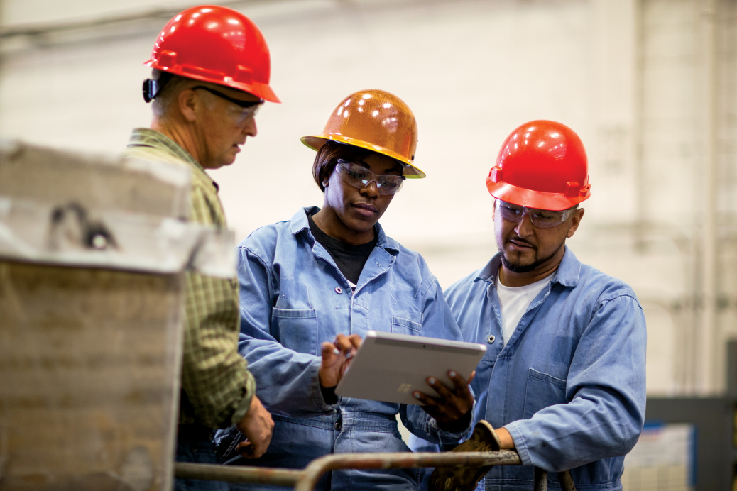 Shop Field Service workers meet with operations manager and team members.