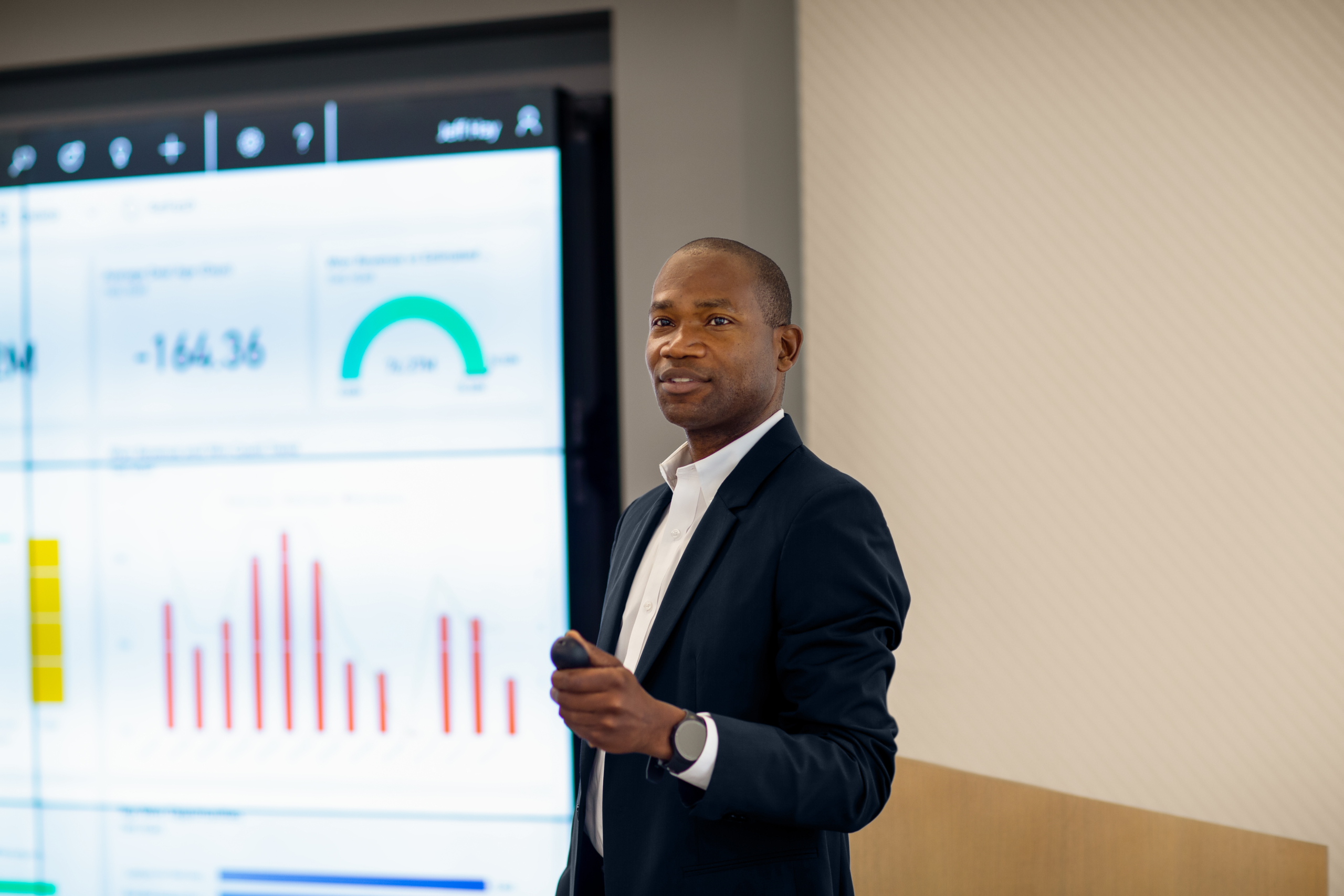 CFO presenting sales results to large group meeting