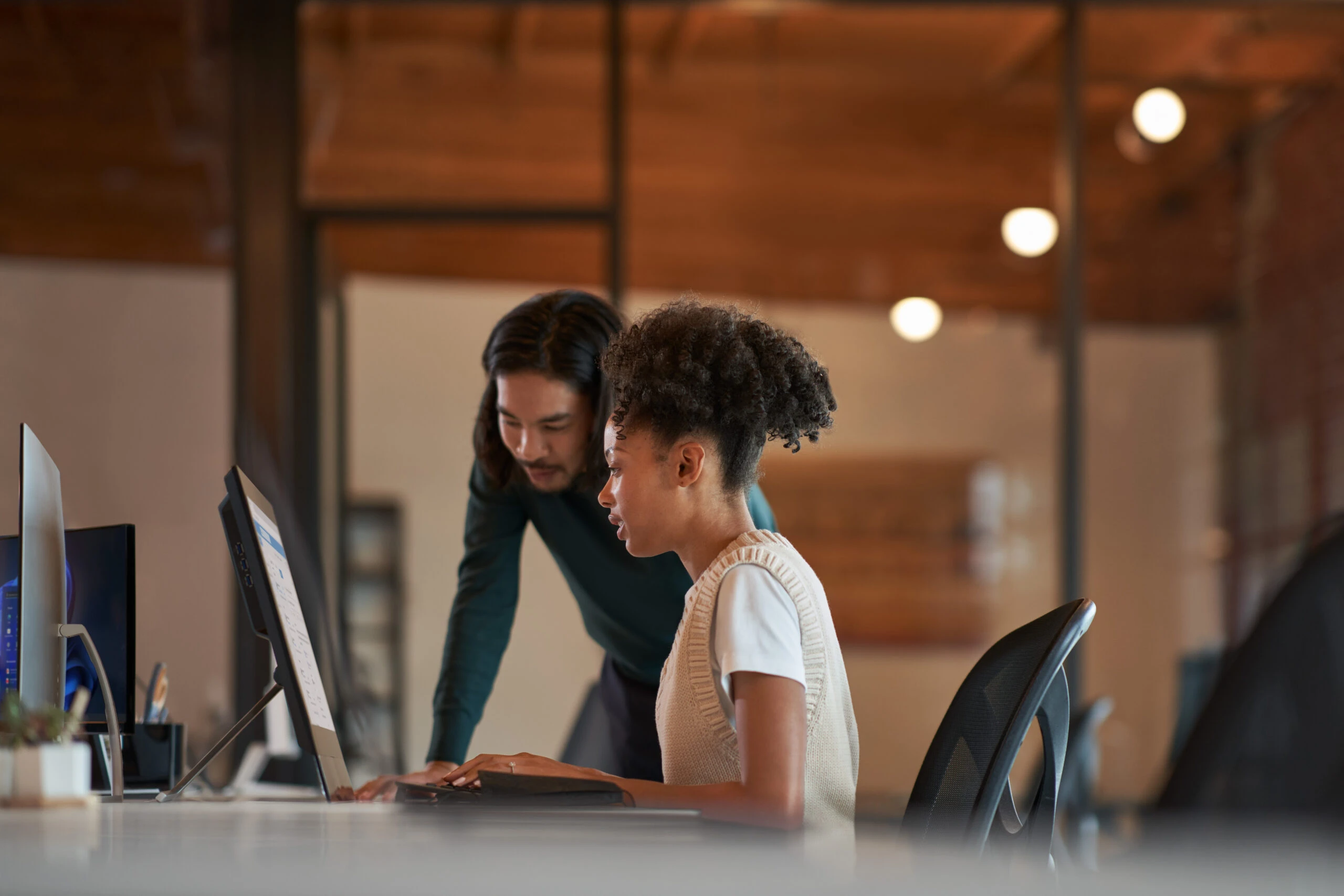 Enterprise office workers collaborating in an open work space.