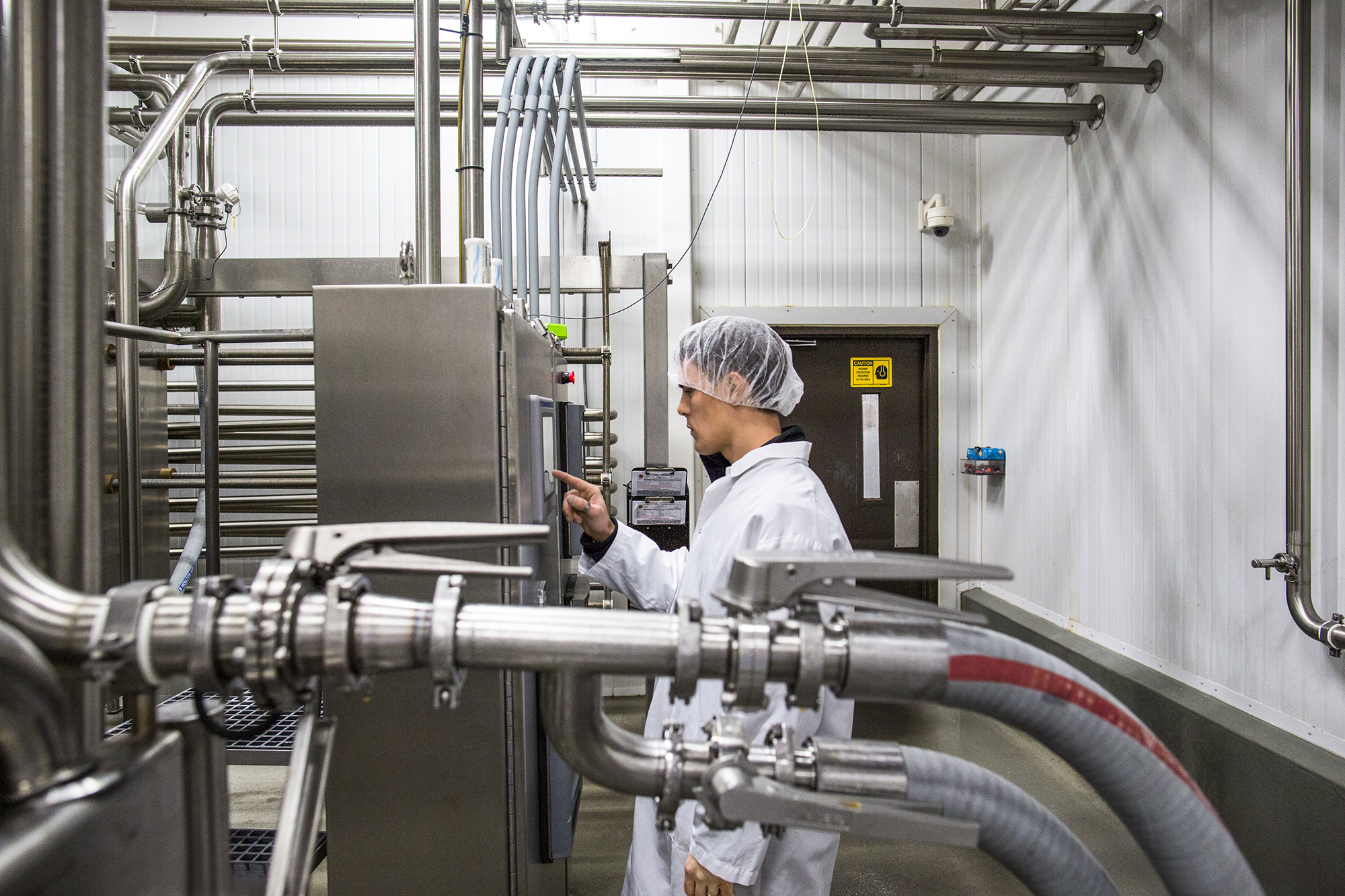 Photo of a worker in a manufacturing facility.
