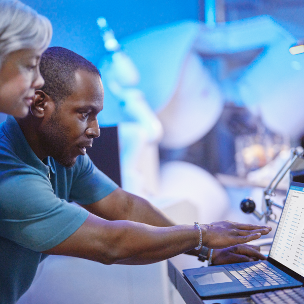people looking at a computer