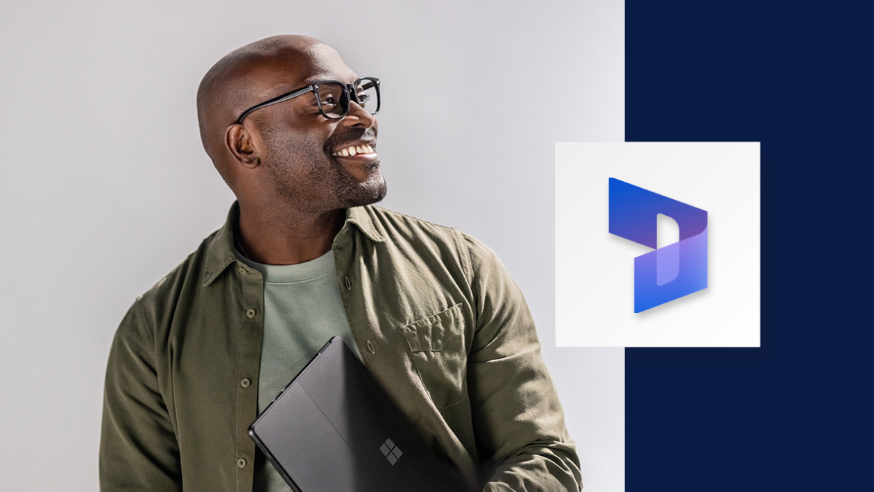 Portrait of smiling man carrying a Surface tablet. A wide, dark blue border runs down the right side of the image, overlaid with the Microsoft Dynamics 365 icon.