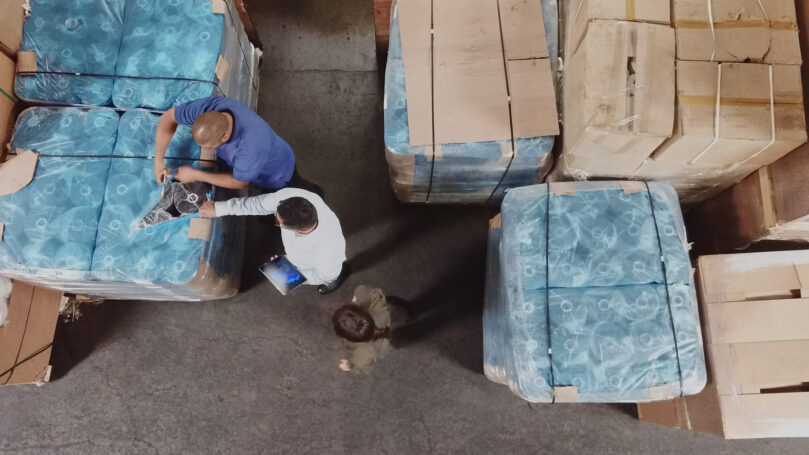 Aerial view of people working in factory.