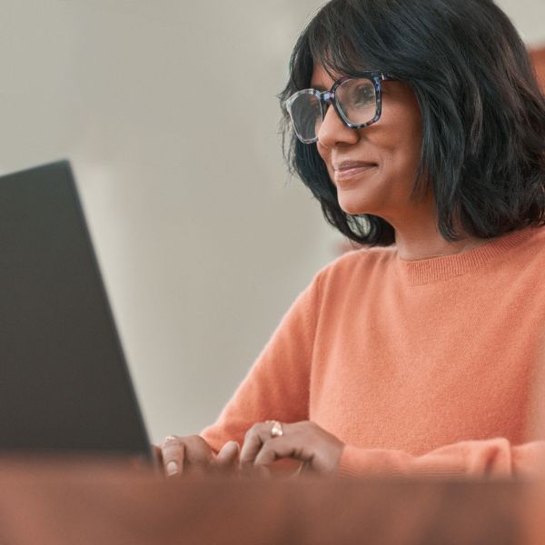 A person working on a laptop.