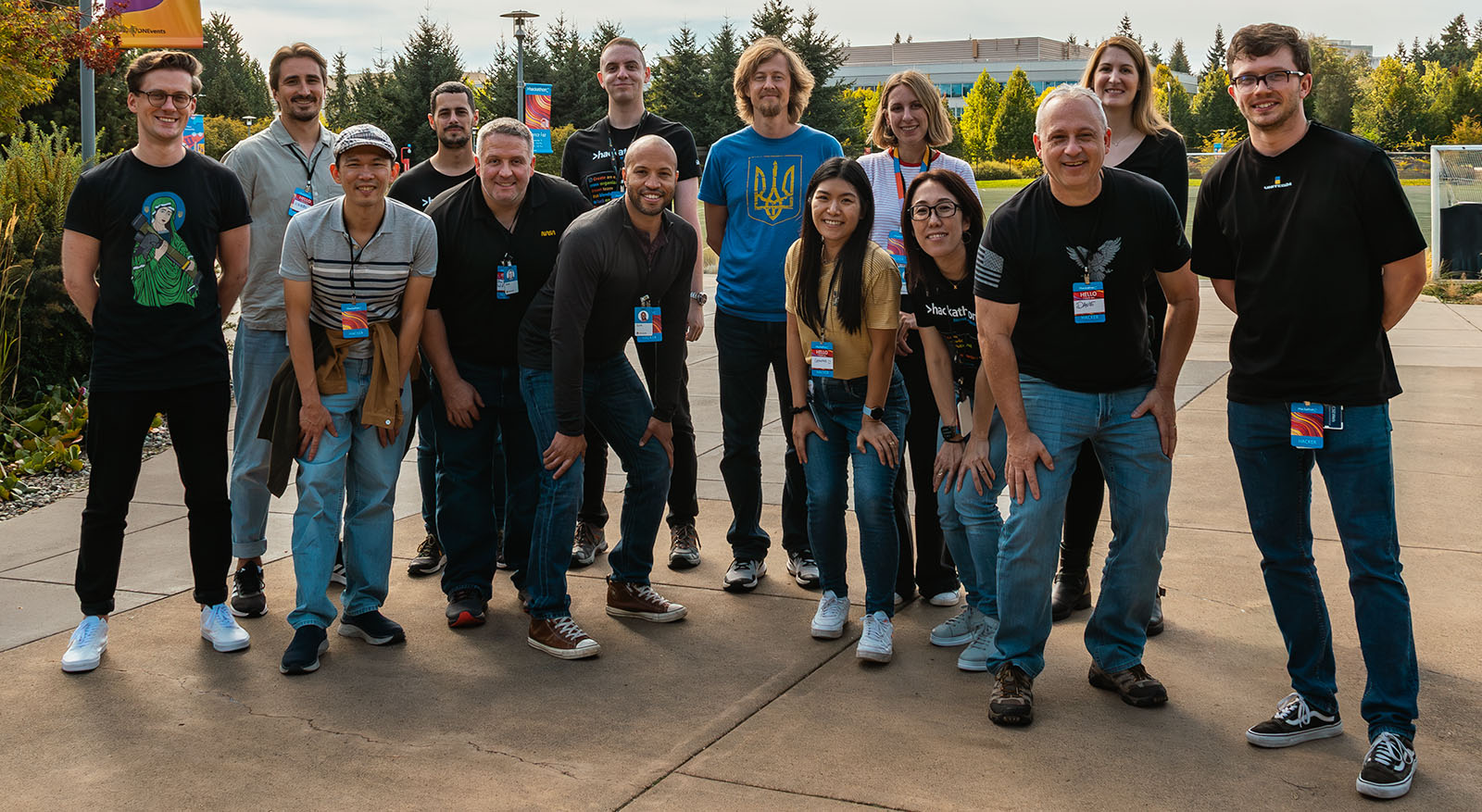 Team members as a group of 14 individuals posing for a photograph