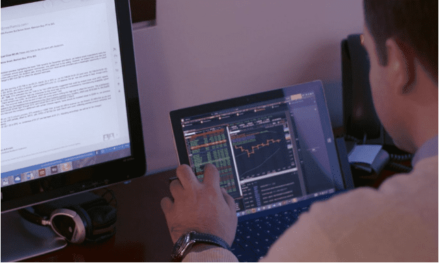 Image of a person working at his desk