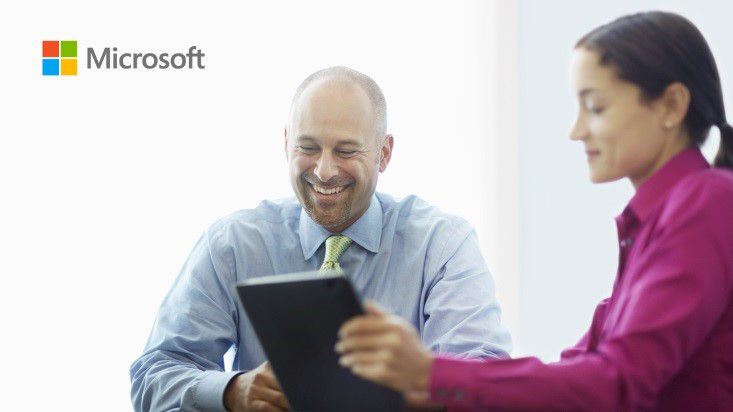 Picture of two co-workers in an office setting