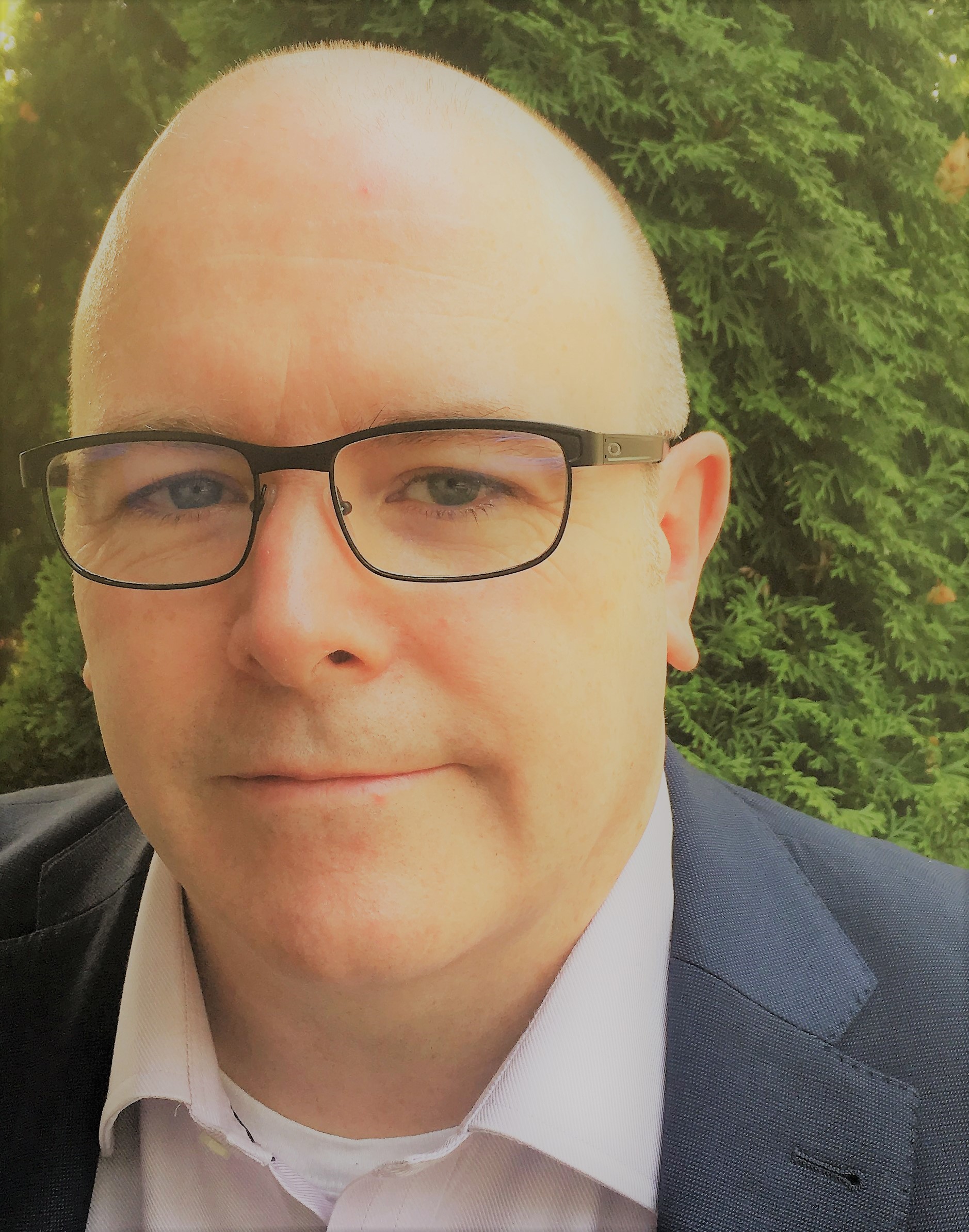 a man wearing sunglasses posing for the camera