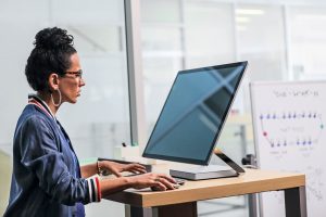 A woman working on a computer.