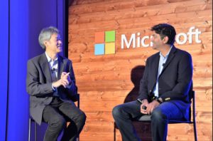 A photo of Peter Lee and Aneesh Chopra.