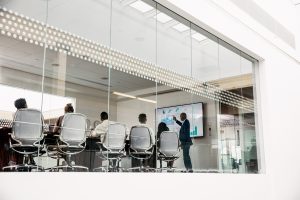 Person presenting in a board room