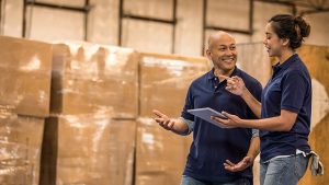 Two employees working in a warehouse