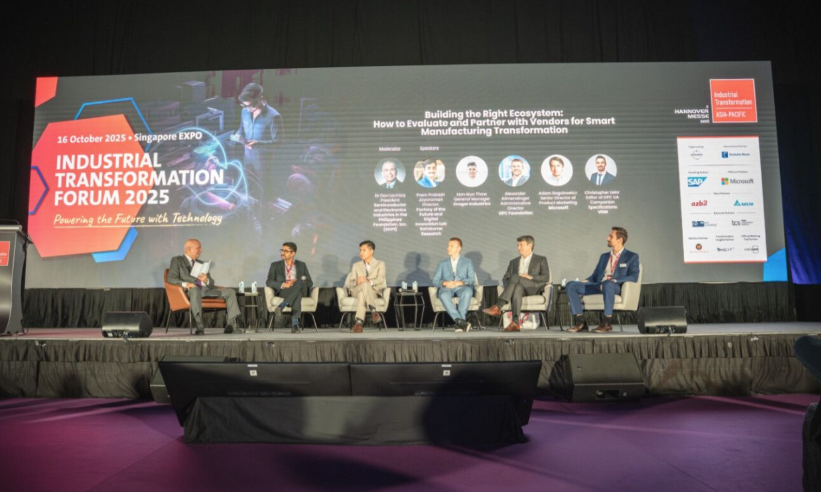 A group of people sitting on a stage

AI-generated content may be incorrect.