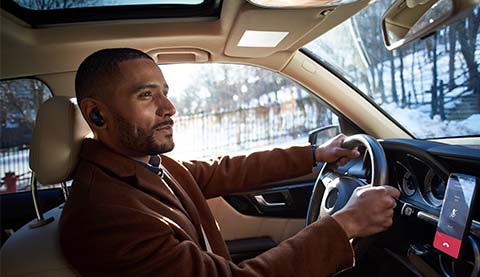 Man driving his car during the winter