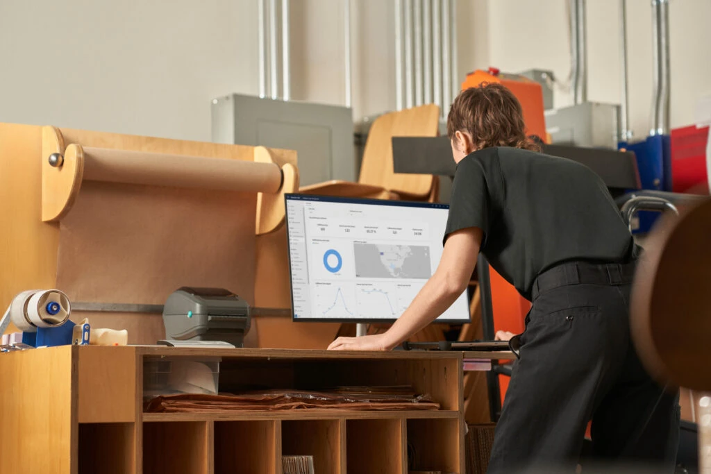 Customer service receiving online orders, analysing data and managing inventory in the storeroom. Data can help build sustainability in retail.