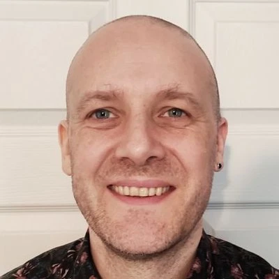 A headshot photograph of Mark Allan.