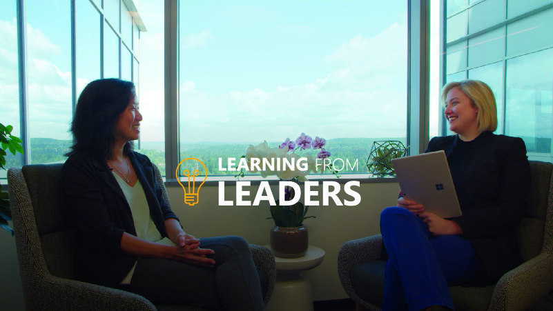 2 women sitting next to a window
