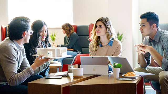 a group of people sitting at a table