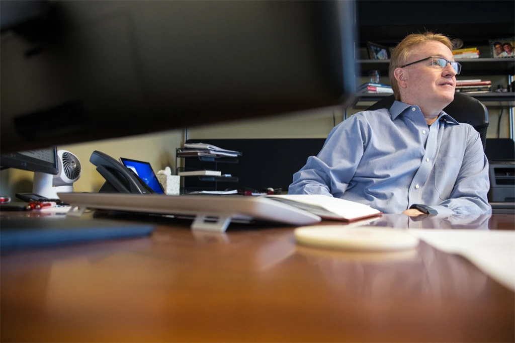 Man sitting at his office desk
