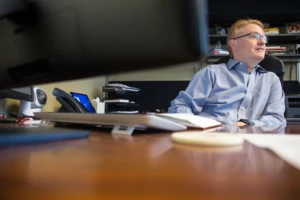 Man sitting at his office desk