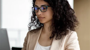 woman looking at her laptop