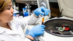 lab researcher examining test tube a