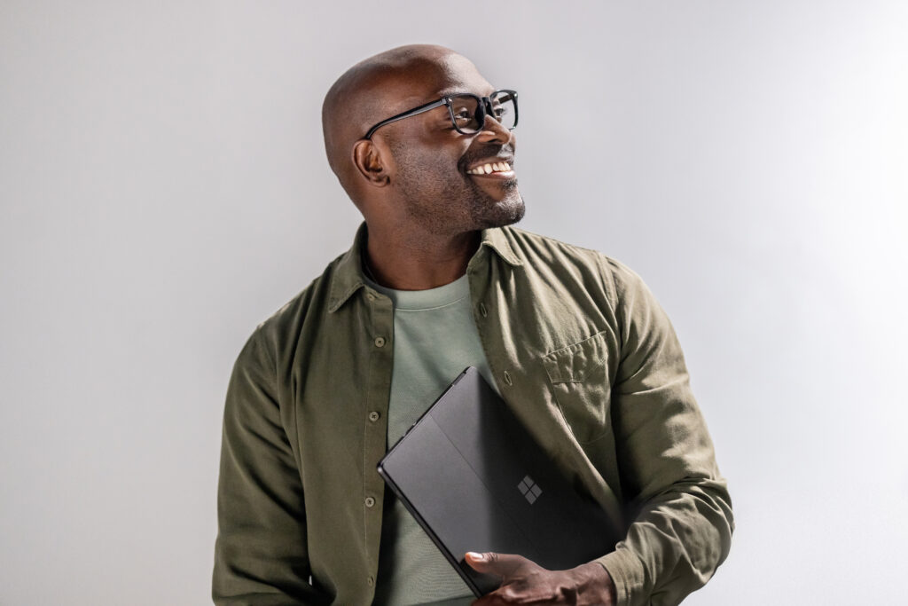 A man holding a laptop