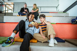 A group of people sitting on the stairs
