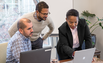 A group of people collaborate in a meeting.