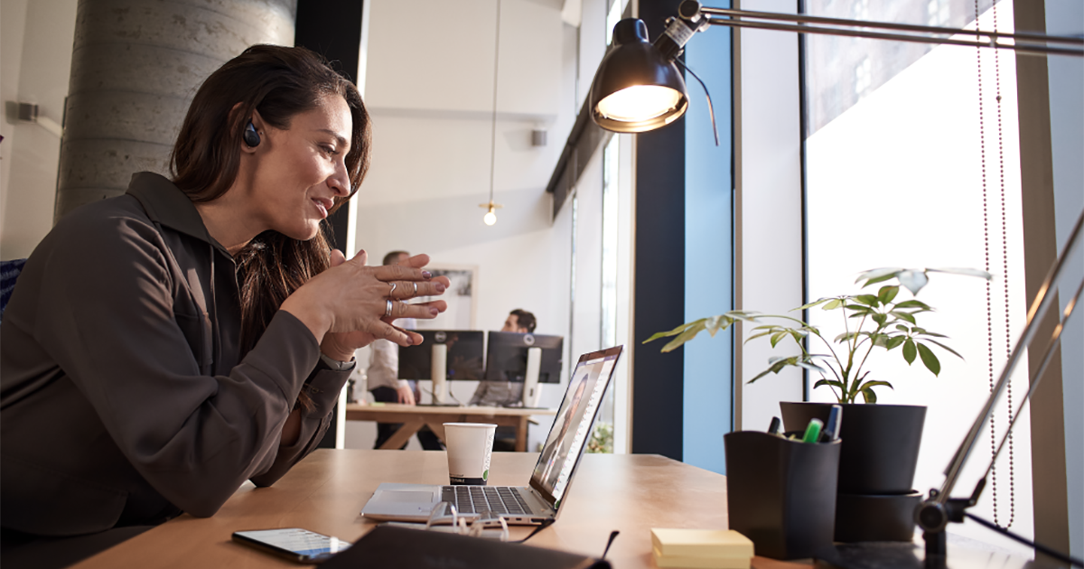An image of a female tech executive working on her laptop computer.