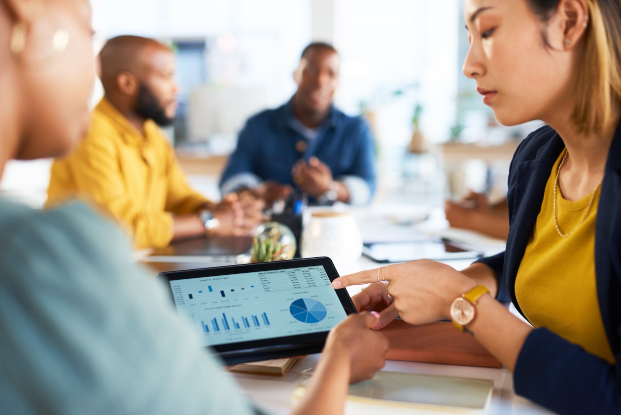 A woman pointing at a tablet