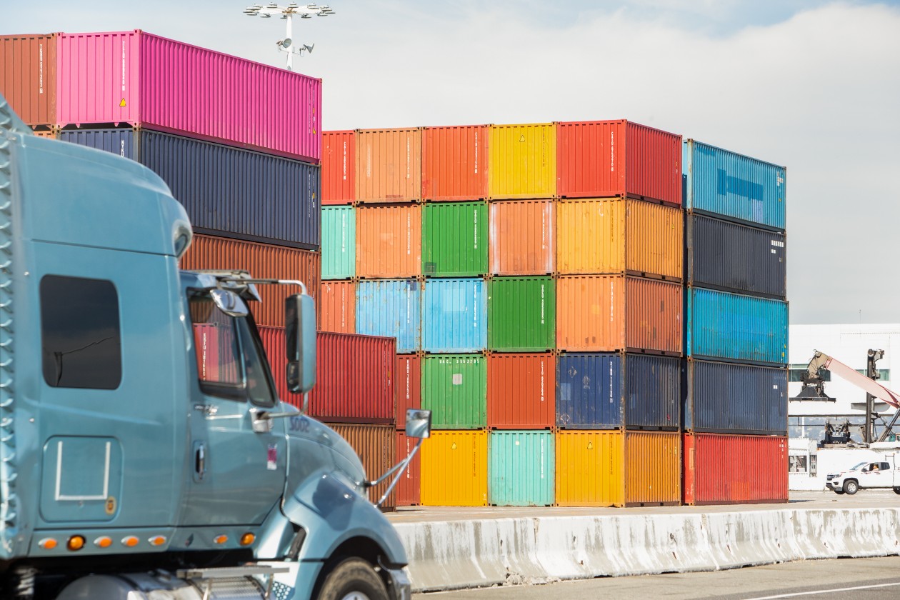 Tighter shot of colorful shipping containers; environmental shot.