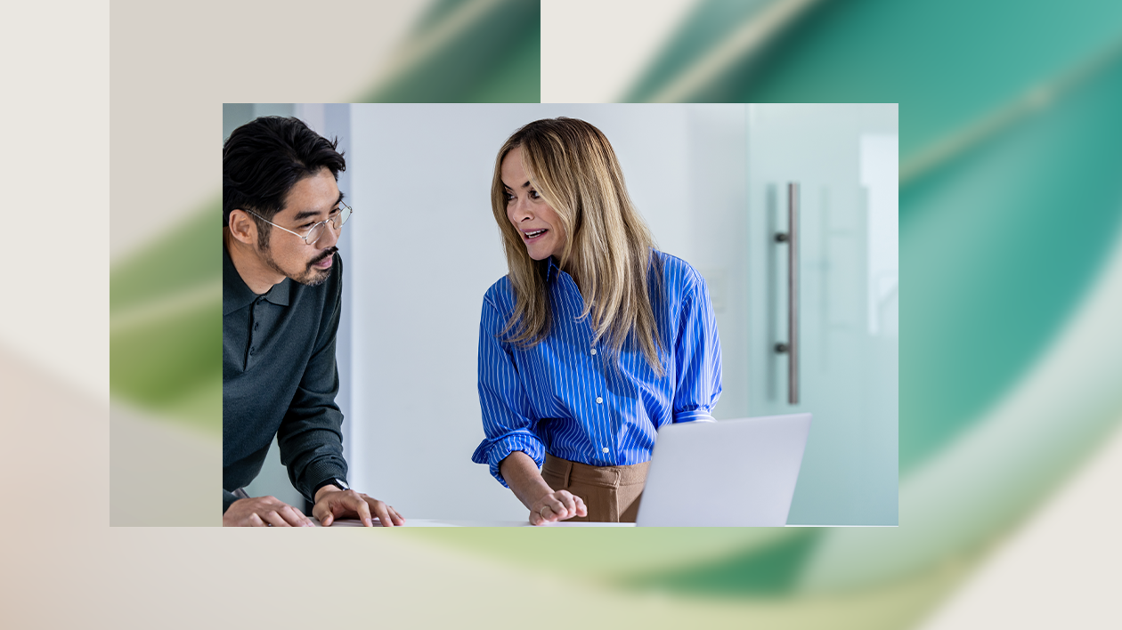 Electric car engineers collaborating in factory office.