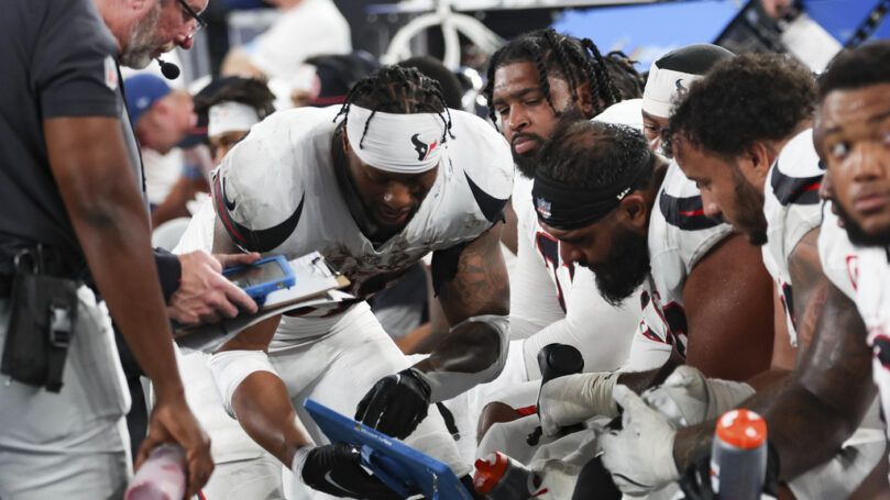 A group of football players in a group
